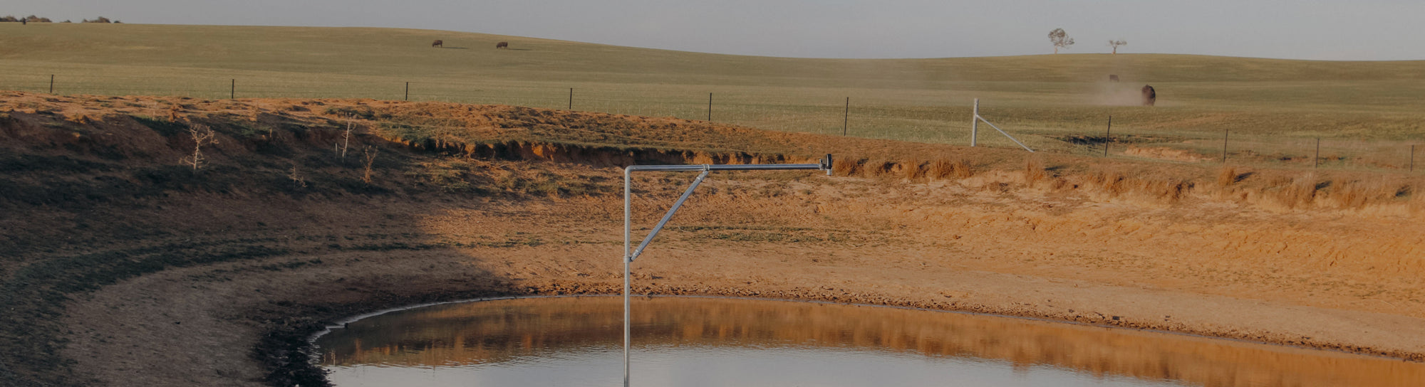 A sensor on a pole above a sediment pond